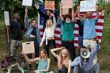 positive demonstrators, drug users with placards in the park. participants want cannabis to be legal