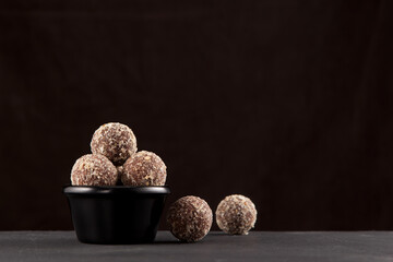 Healthy homemade sweets. Fitness snack. Energy balls made of dates, apricots, almonds, pine nuts...
