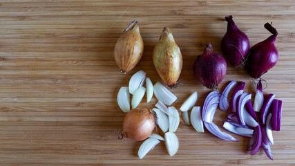 chopped shallots on wooden board 