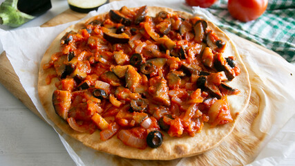 Eggplant pizza with tomatoes in italy
