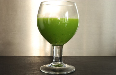 Photography of a glass of vegetables juice on slate with stainless background for food illustrations