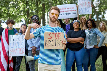 diverse american people took to the public park and streets to protest anti-black racism and police brutality. black lives matter, blm concept