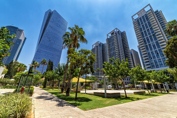 Modern buildings and urban park in Tel Aviv, Israel.