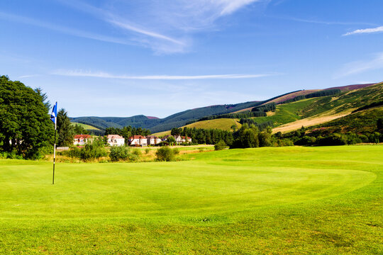 Golf course under a clear blue sky in southern Scotland on a sunny summer day. United Kingdom
