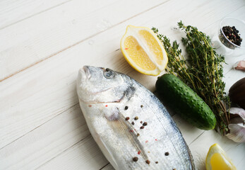 Fresh fish dorado. Dorado and ingredients for cooking.Top view with copy space.