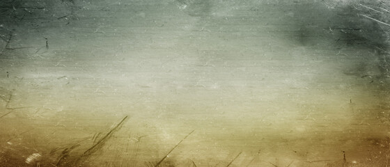 Abstract yellow green background with soft bright gold center glowing with light colors and dark blue green border with blurred mottled texture