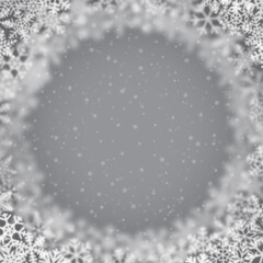 Christmas background of snowflakes of different shape, blur and transparency, arranged in a circle, on gray background