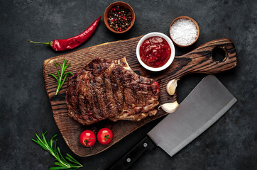 Marbled beef steak
grill
with spices on a stone background