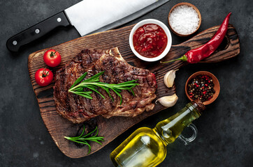 Marbled beef steak
grill
with spices on a stone background