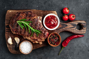 Marbled beef steak
grill
with spices on a stone background