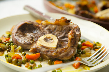 Baked ossobuco baked with vegetables