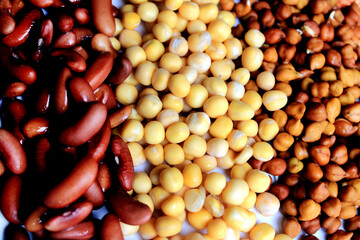 Collection of legumes (chickpeas, green peas, Pink lentils, Dry peas, Pigeon Peas, Red Kidney) isolated on white background.