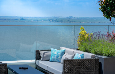 sofa with pillows and beautiful view