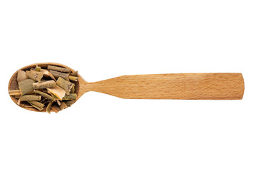 Dried willow bark in a wooden spoon on a white background. Phytotherapy and disease prevention. Herbal collection for medicinal tinctures. Herbal tea in folk medicine. The view from the top