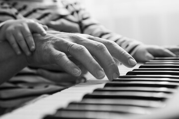 my mother teaches me to play the piano