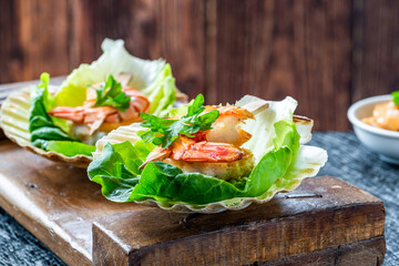Canapes with grilled black tiger prawns and seafood sauce