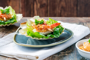 Canapes with grilled black tiger prawns and seafood sauce