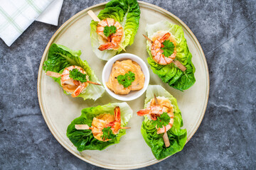 Canapes with grilled black tiger prawns and seafood sauce