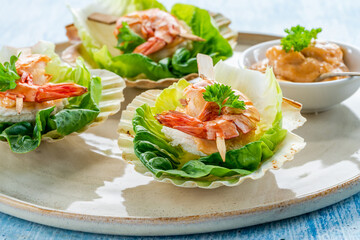 Canapes with grilled black tiger prawns and seafood sauce