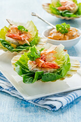 Canapes with grilled black tiger prawns and seafood sauce