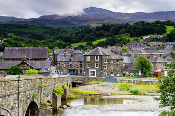 DOLGELLAU - WALES - AUGUST 30, 2017: Old peaceful stone town by the river in a cloudy day in...