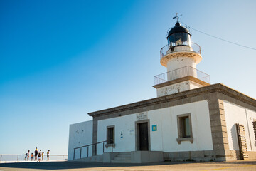 view of cap de creus lighthouse, a beacon of light on the rocky catalan costa brava, on a sunny...