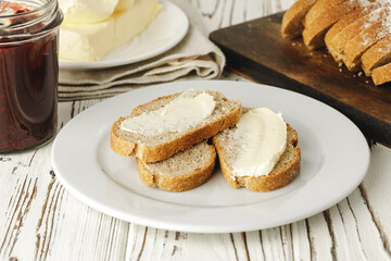 Simple breakfast. Toasted bread covered with butter