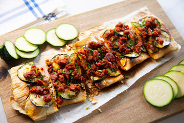 Coca from mallorca with sobrassada and zucchini