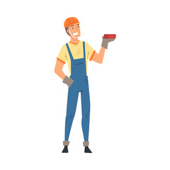 Male Builder, Construction Worker Character in Blue Overalls Standing with Brick Vector Illustration on White Background