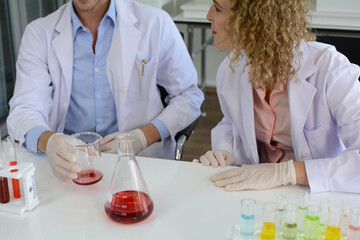 Obraz na płótnie Canvas Scientists studying new substances in lab.