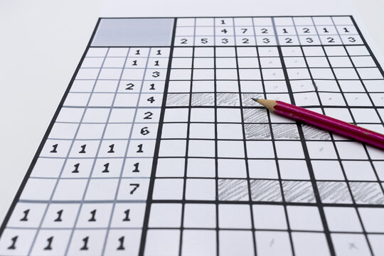 Paper pastime called nonogram, picross, griddlers, hanjie or paint by numbers