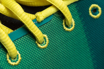 colored laces on sports sneakers close-up