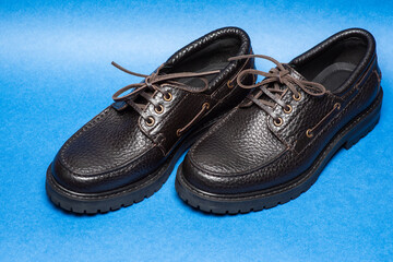 fashionable brown leather boat shoes close-up