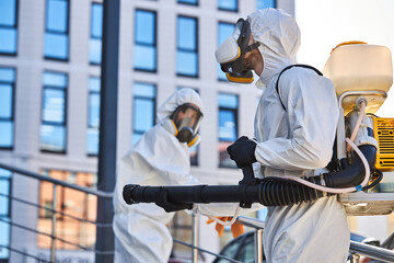 professional cleaning and disinfection at town complex amid the coronavirus epidemic. two workers...