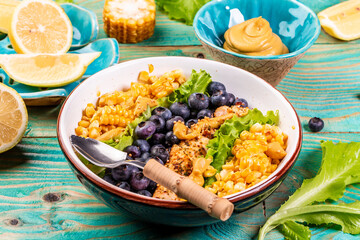 Green salad with berries and corn, healthy food concept, catering
