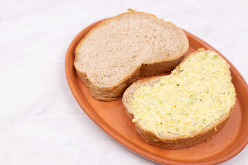 Bread with Avocado spread served on the plate
