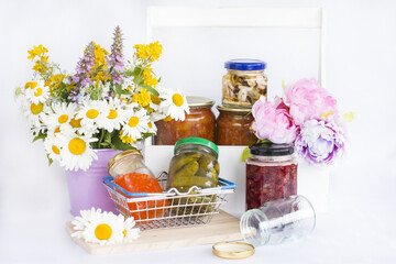 Glass jars with jam and pickles.