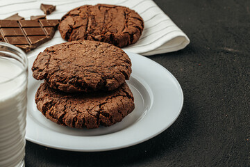 Chocolate cookies on dark table close up