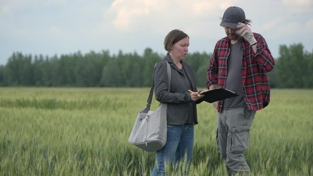 Mortgage loan officer assisting farmer in financial allowance application process