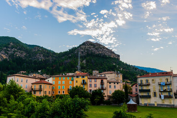 A picturesque wide angle view of a French alpine medieval village during sunrise in summer (Puget-Theniers, Alpes-Maritimes, Provence-Alpes-Cote-d'Azur, France)