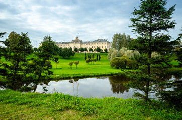 Fototapeta premium Country cottage with a large green summer garden. Beautiful summer landscape landscape park. Nature for background on postcard.