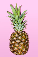 Fresh pineapple on a pastel pink background. Summer concept. Flat lay, top view