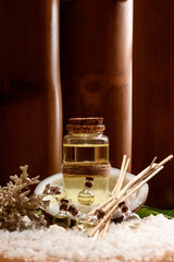 Close-up: bottles of different sizes with organic oil for body care, face and massage. Spa treatments. Natural background.