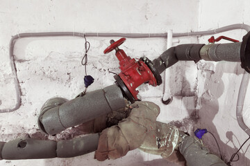 Faucets on old water pipes. Emergency. Basement Heating System