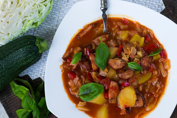 Homemade lecho with sausage, red pepper, tomatoes and zucchini. Traditional Hungarian stew.