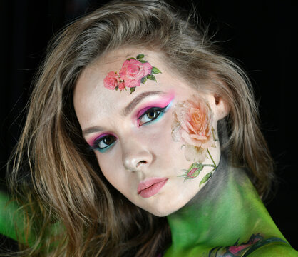 beautiful girl with flowers on her face and painted with burgundy peonies posing in different poses on a black background