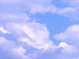 Background overlay photo of white and pink clouds in blue sky