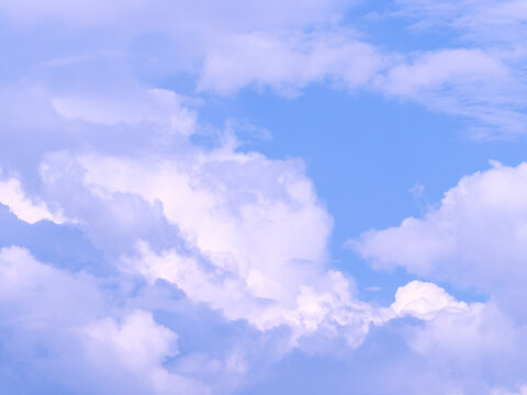 Background overlay photo of white and pink clouds in blue sky