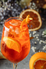Aperol spritz cocktail on a gray concrete background. a glass of aperol spritz with orange slices....