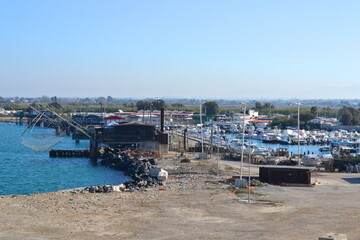 overview of old fisher harbour in fiumicino with sea